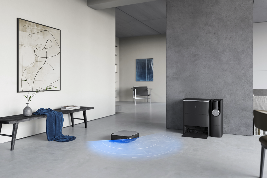 Robot Deebot X2 Combo hút bụi trên sàn, đầu hút cầm tay nằm trong kệ gắn liền với dock sạc. Ảnh: Ecovacs